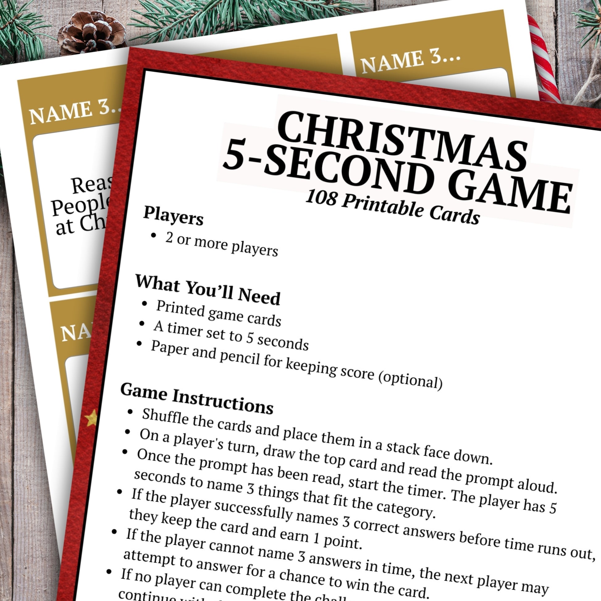 Printable game cards for a Christmas 5-second game, shown as overlapping white cards with gold and red borders and black text. The main card reads 'CHRISTMAS 5-SECOND GAME' and includes instructions and player rules.