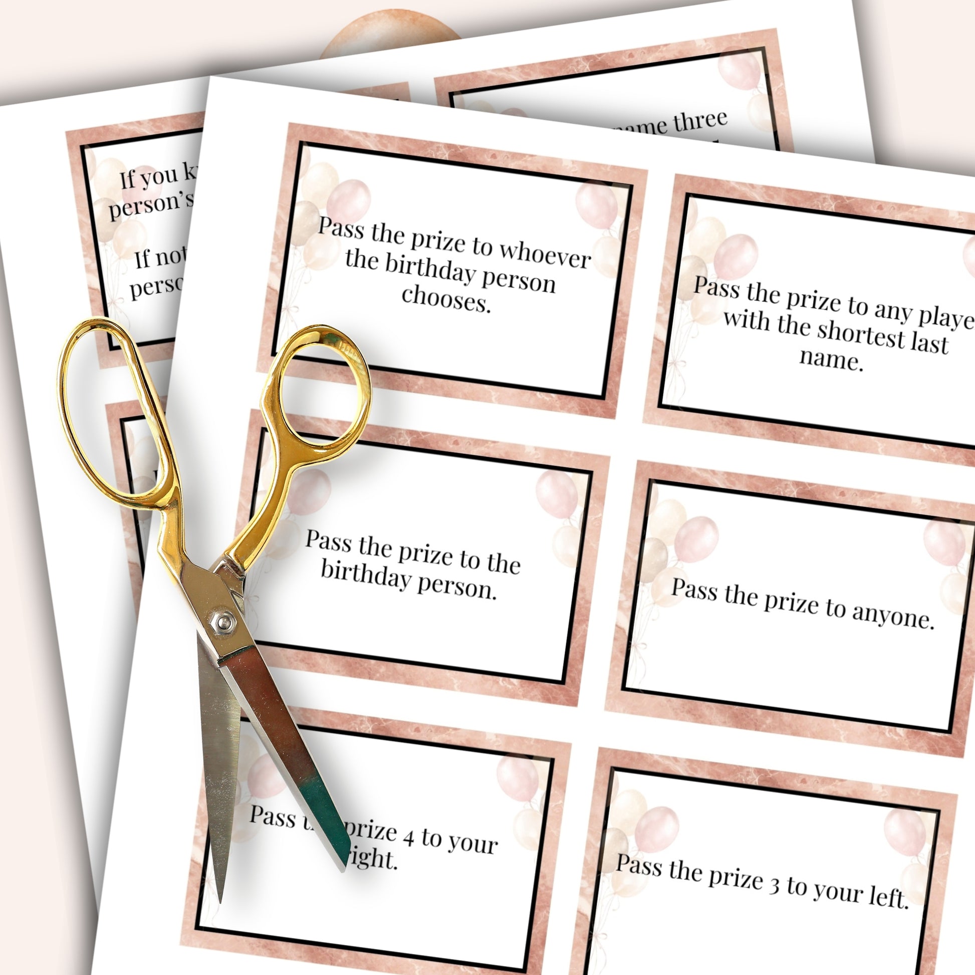 Game cards with text instructions and a pair of scissors on a white background